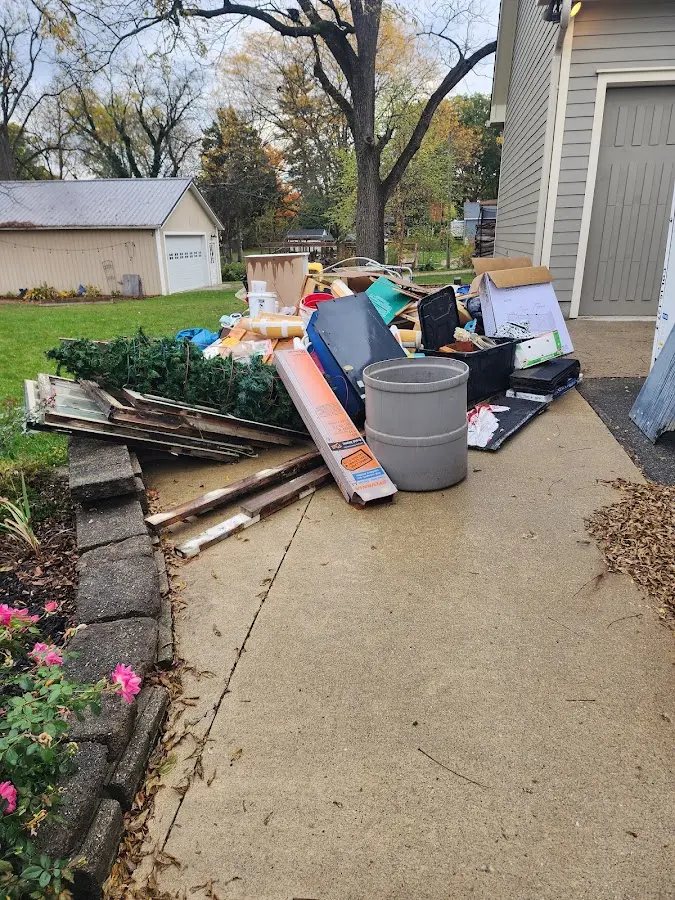 Dumpster being loaded with debris for Residential Dumpster Rental in Unity